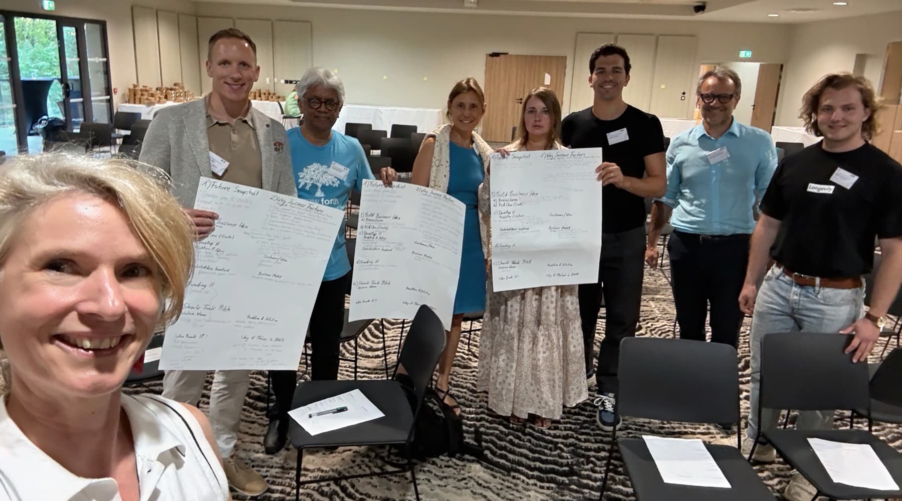 Participants presenting future scenarios created during a longevity workshop